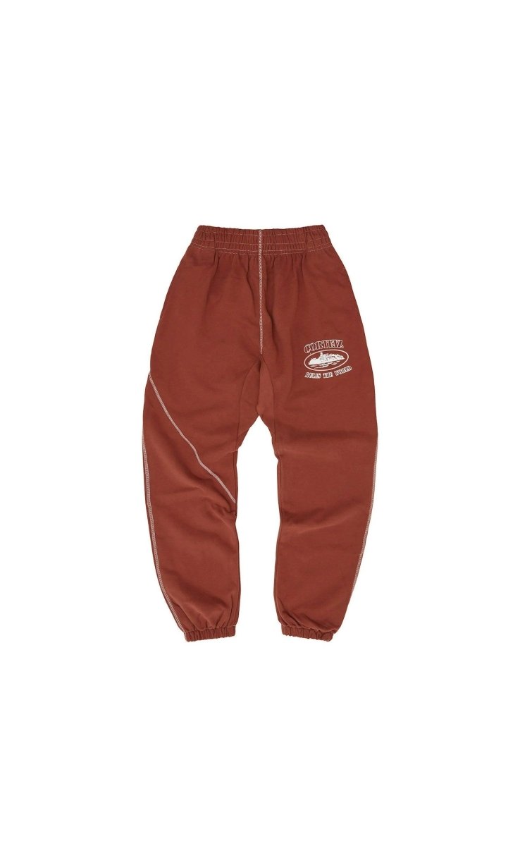 Corteiz Superior Bottoms in rust color featuring a sporty design and elastic waistband for comfort.