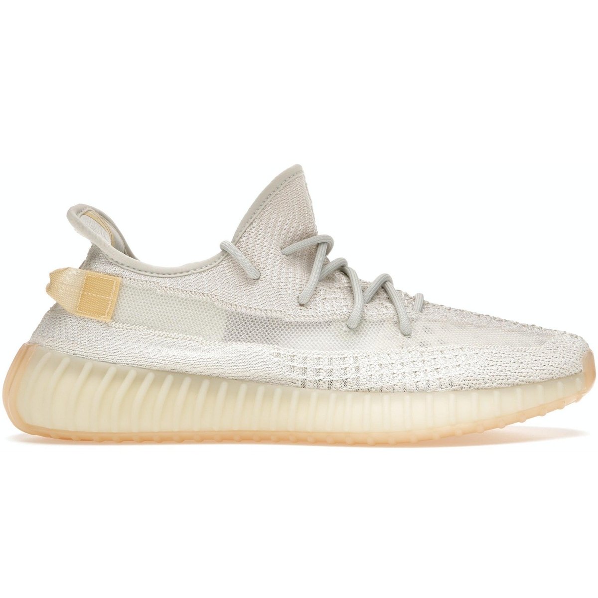 adidas Yeezy Boost 350 V2 Light sneaker with UV-sensitive technology and cream knit upper in natural light.