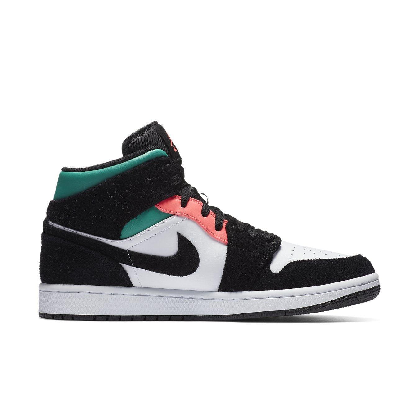 Jordan 1 Mid SE South Beach sneakers featuring a white leather base and black suede overlays, vibrant pink and aqua accents.