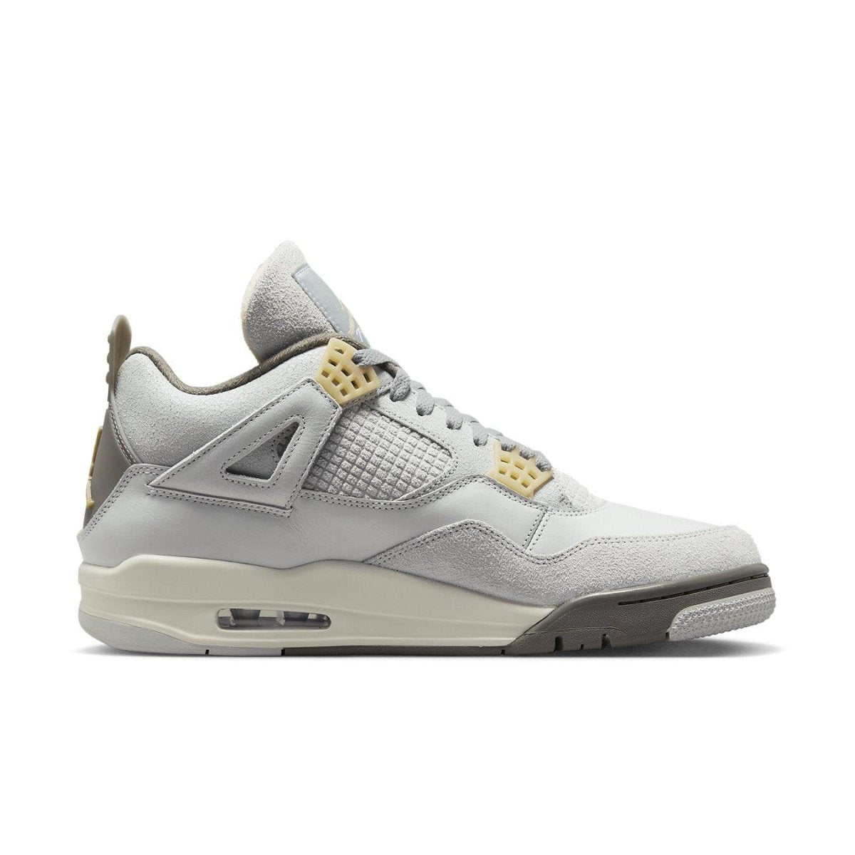 Air Jordan 4 Retro SE Craft Photon Dust in light grey suede with distinctive design features.