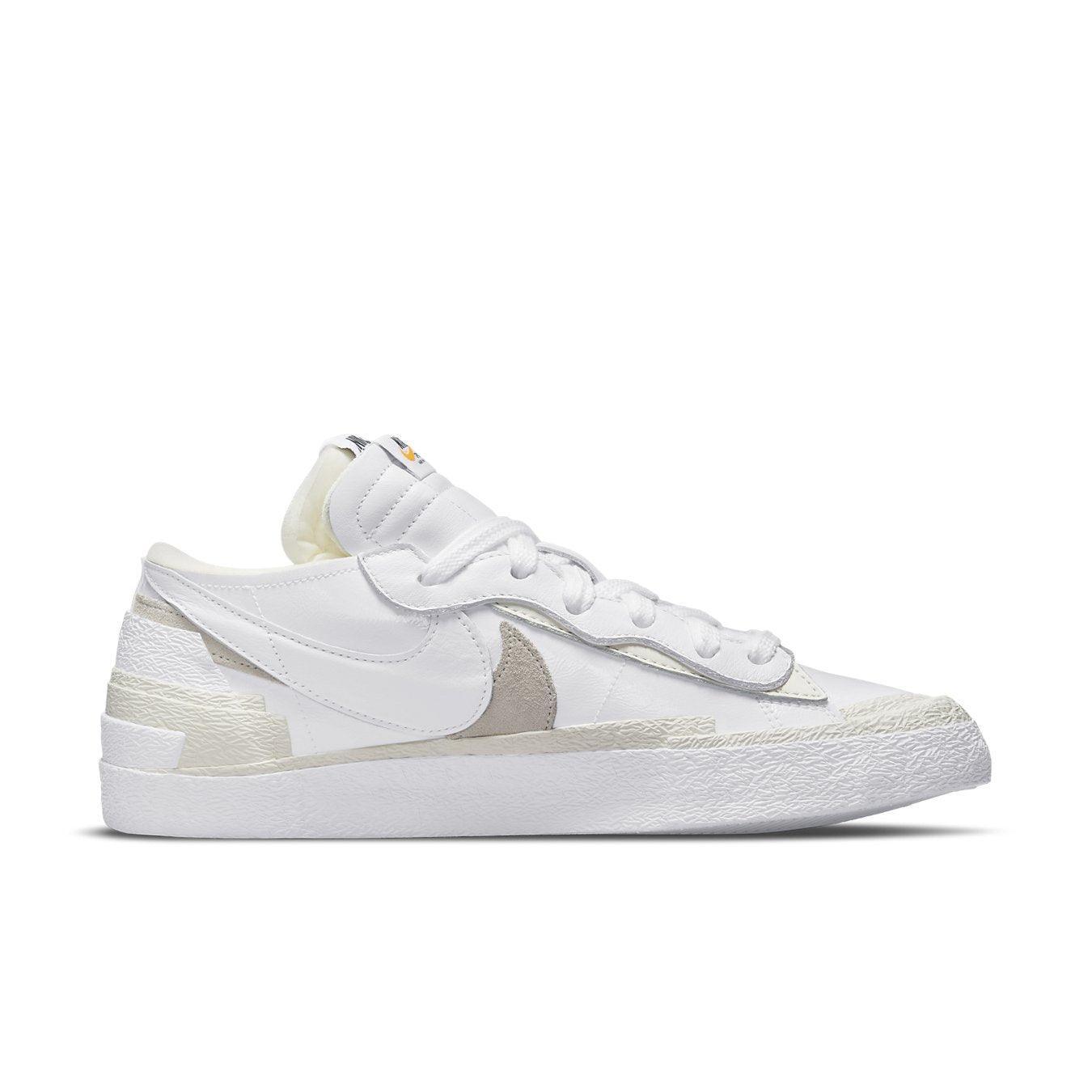 Nike Blazer Low Sacai White Patent Leather side view with dual Swooshes and glossy finish.