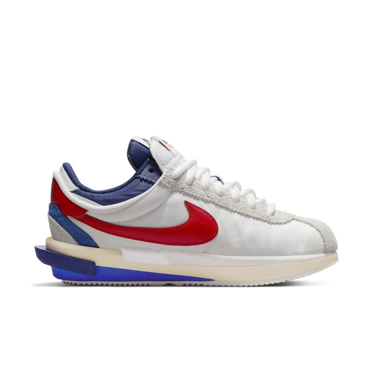 Nike Cortez 4.0 Sacai in white, red, and blue with dual-layer design and visible Zoom Air unit.