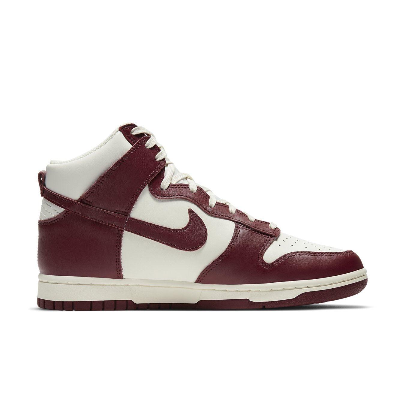 Nike Dunk High Sail Team Red women's shoes featuring white leather and bold red overlays for a stylish contrast.
