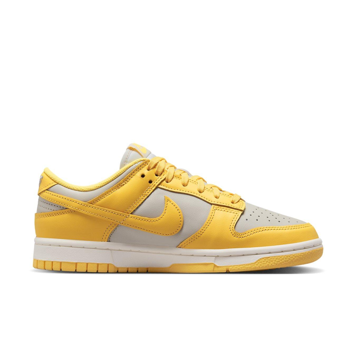 Nike Dunk Low Citron Pulse (W) in yellow and gray, featuring perforated toe and cushioned sole for comfort.