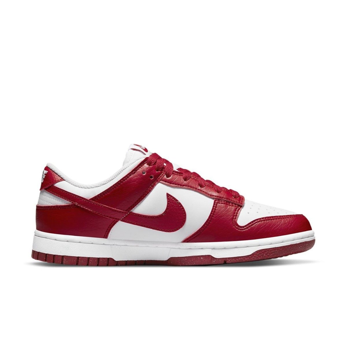 Nike Dunk Low Next Nature in white and gym red, featuring sustainable materials and classic design.
