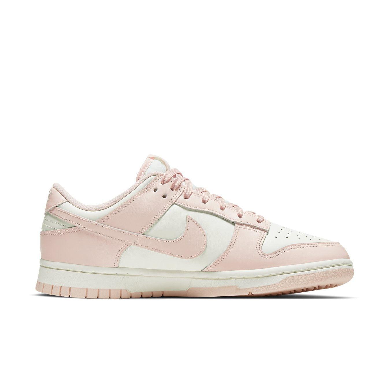 Nike Dunk Low Orange Pearl (W) sneakers featuring a pink and white design, perfect for style on and off the court.