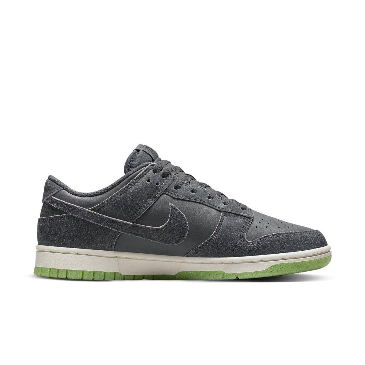 Nike Dunk Low Retro PRM Halloween 2022, grey suede sneaker with double swoosh and green outsole.