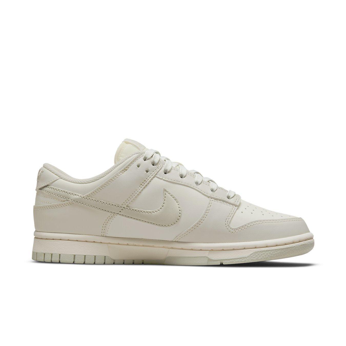 Nike Dunk Low Sail Light Bone women's sneaker with sleek design and neutral colorway.