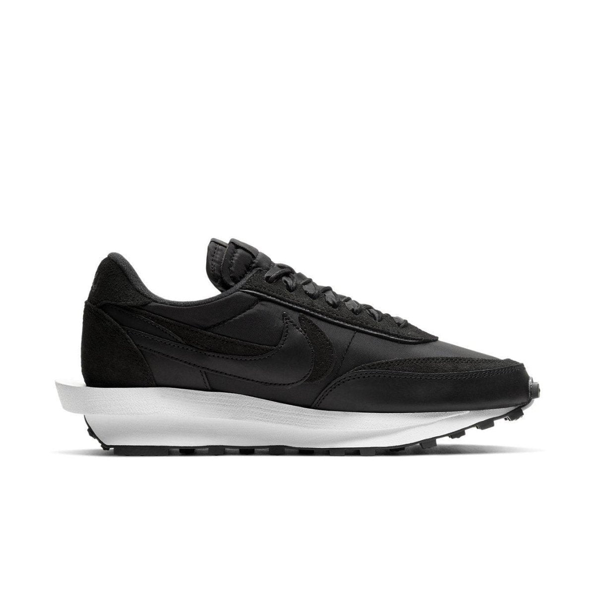 Nike LD Waffle Sacai sneakers in black nylon with white sole, featuring double tongue and Swoosh design.
