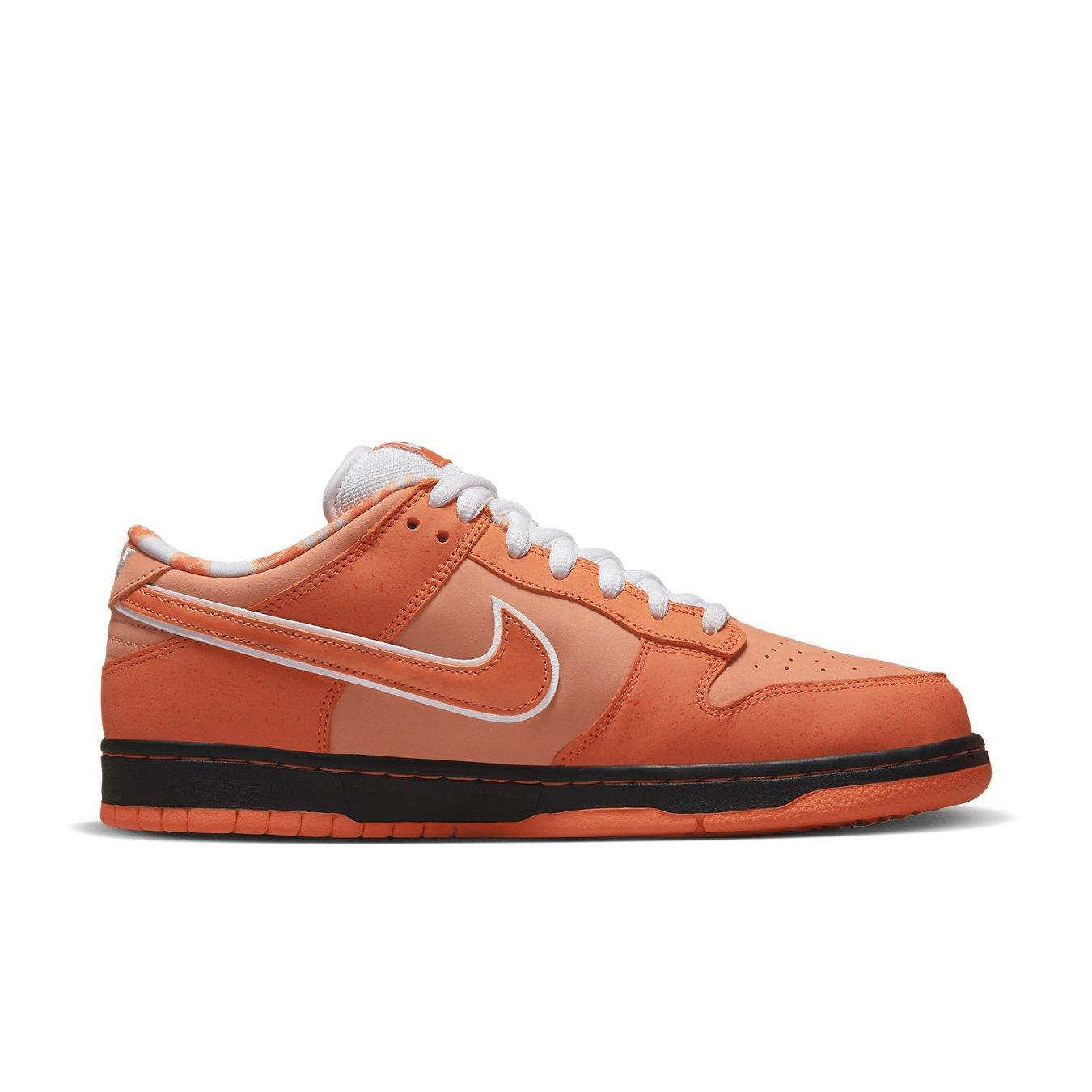 Nike SB Dunk Low Concepts Orange Lobster in orange nubuck with white Swoosh and black sole.