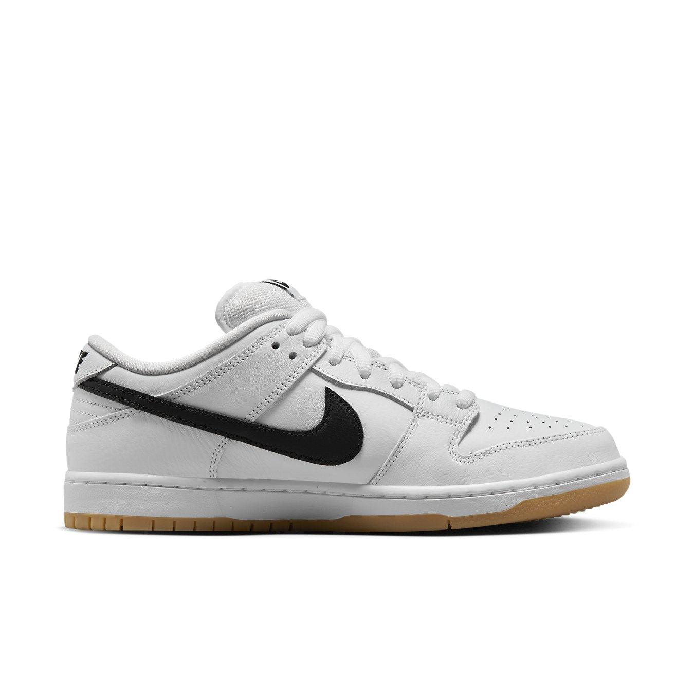 Nike SB Dunk Low Pro in white with black Swoosh and gum sole, featuring premium leather upper.