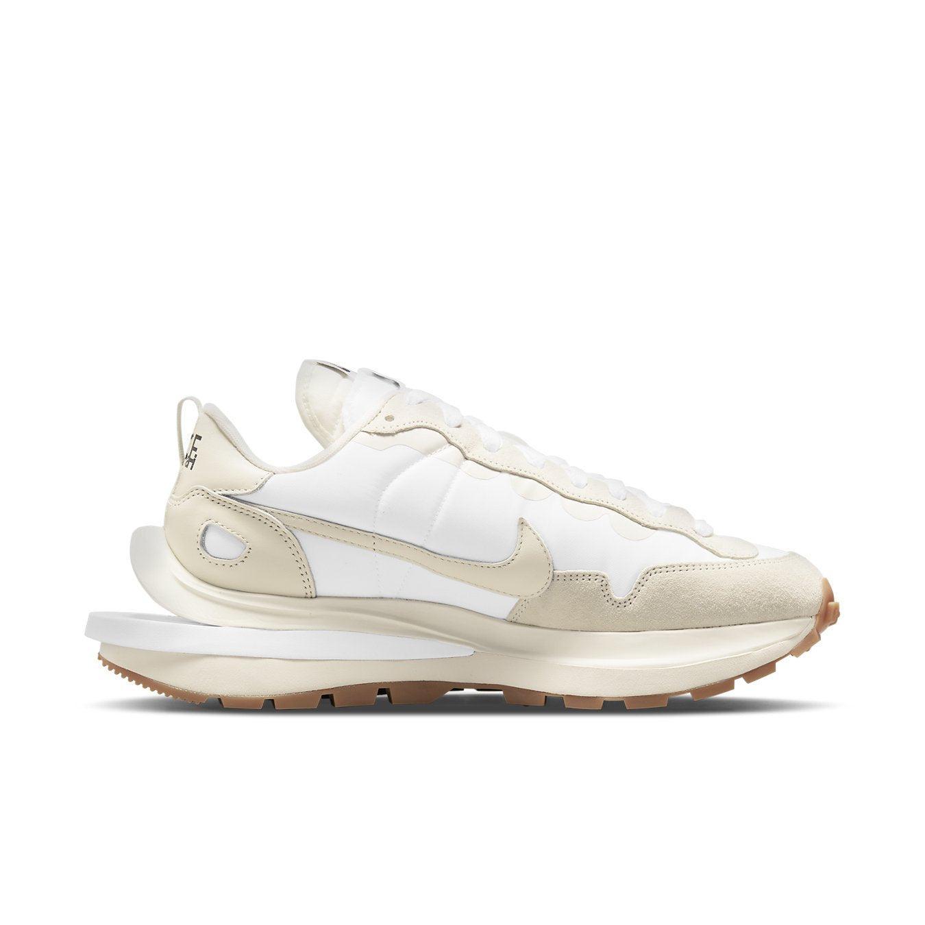 Nike VaporWaffle Sacai 'Sail Gum' sneaker featuring a nylon, suede, and leather upper with double laces in a stylish design.