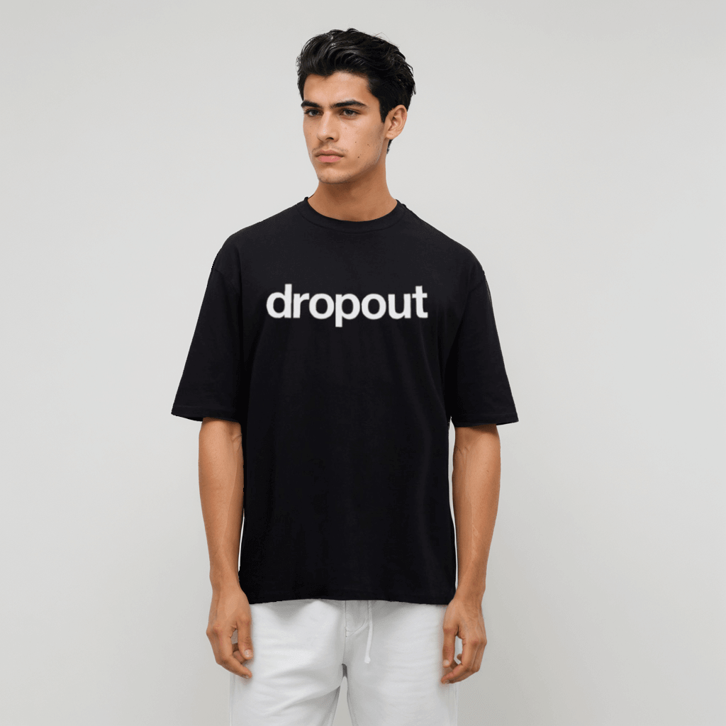 Model wearing a black oversized tee with bold Dropout logo, made from soft breathable cotton.