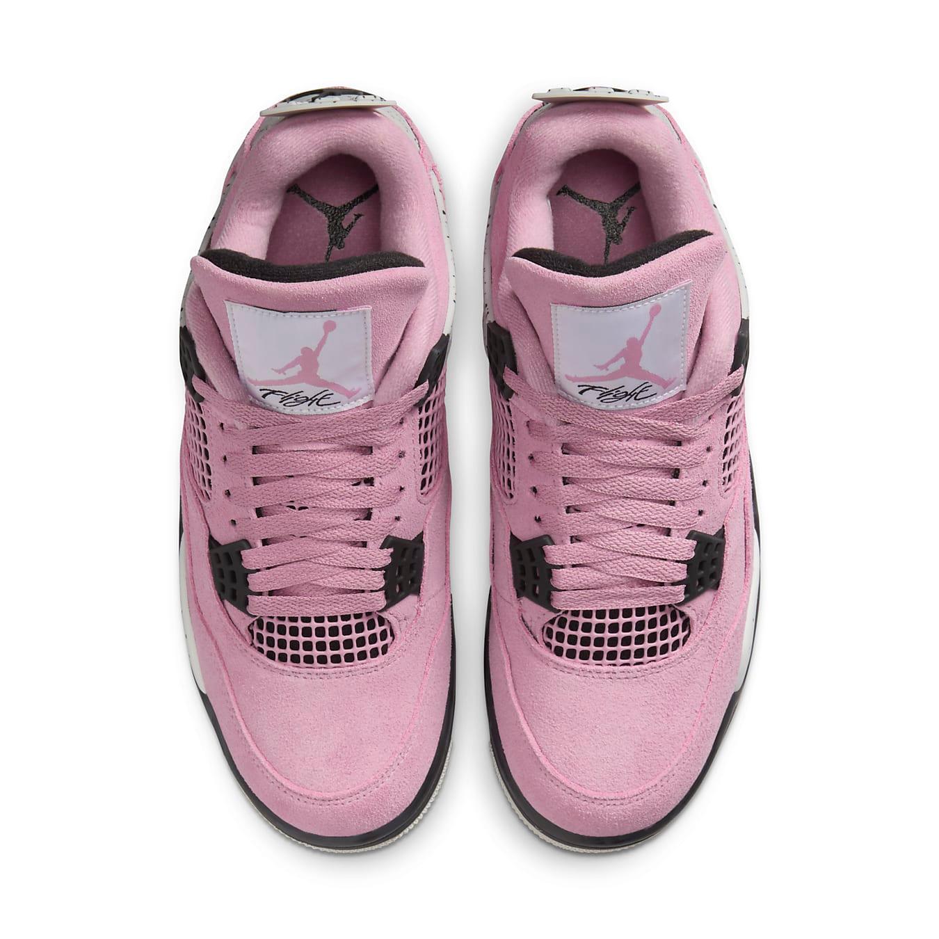 Top view of Women's Air Jordan 4 Retro 'Orchid' sneakers in soft lilac suede with black accents.