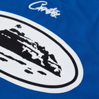 Close-up of Corteiz Alcatraz Football Jersey in navy, featuring a bold graphic logo on soft fabric.