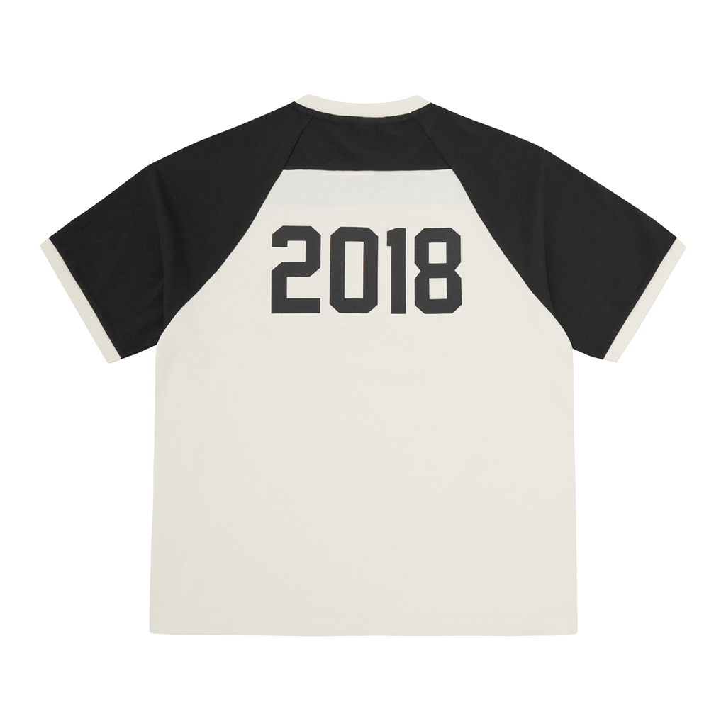 Corteiz Alcatraz Wrap Around Raglan Tee Off White/Black featuring 2018 on the back, stylish and casual design.
