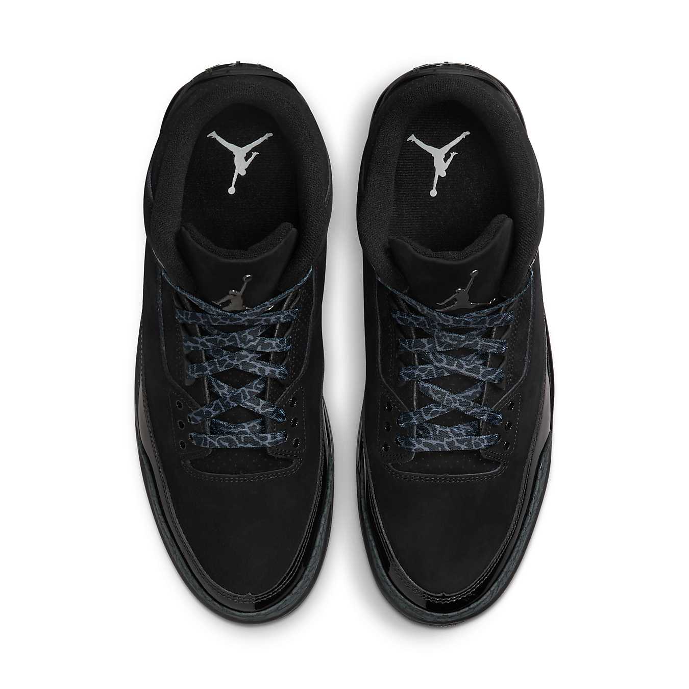 Top view of the Air Jordan 3 Retro Black Cat (2025) featuring a sleek all-black nubuck upper and signature elephant print.