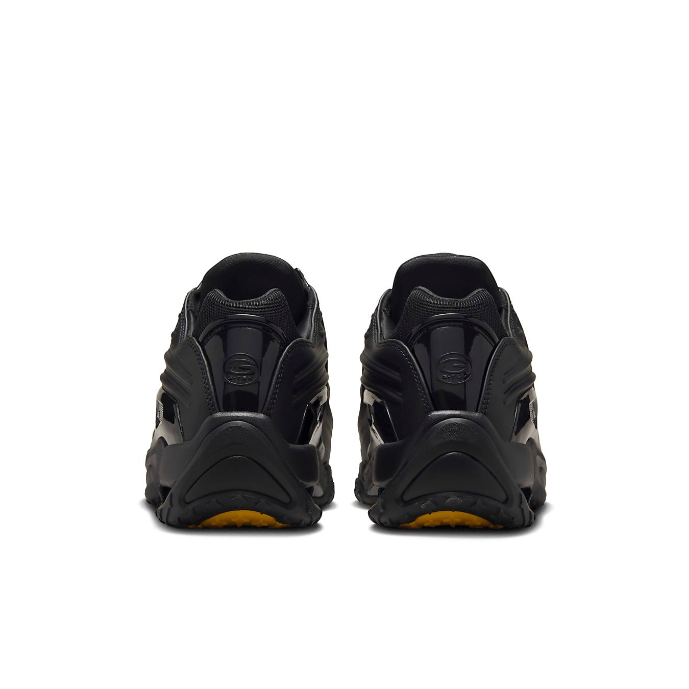 Rear view of Nike Hot Step 2 Drake NOCTA sneakers in black with stylish design and cushioned sole.