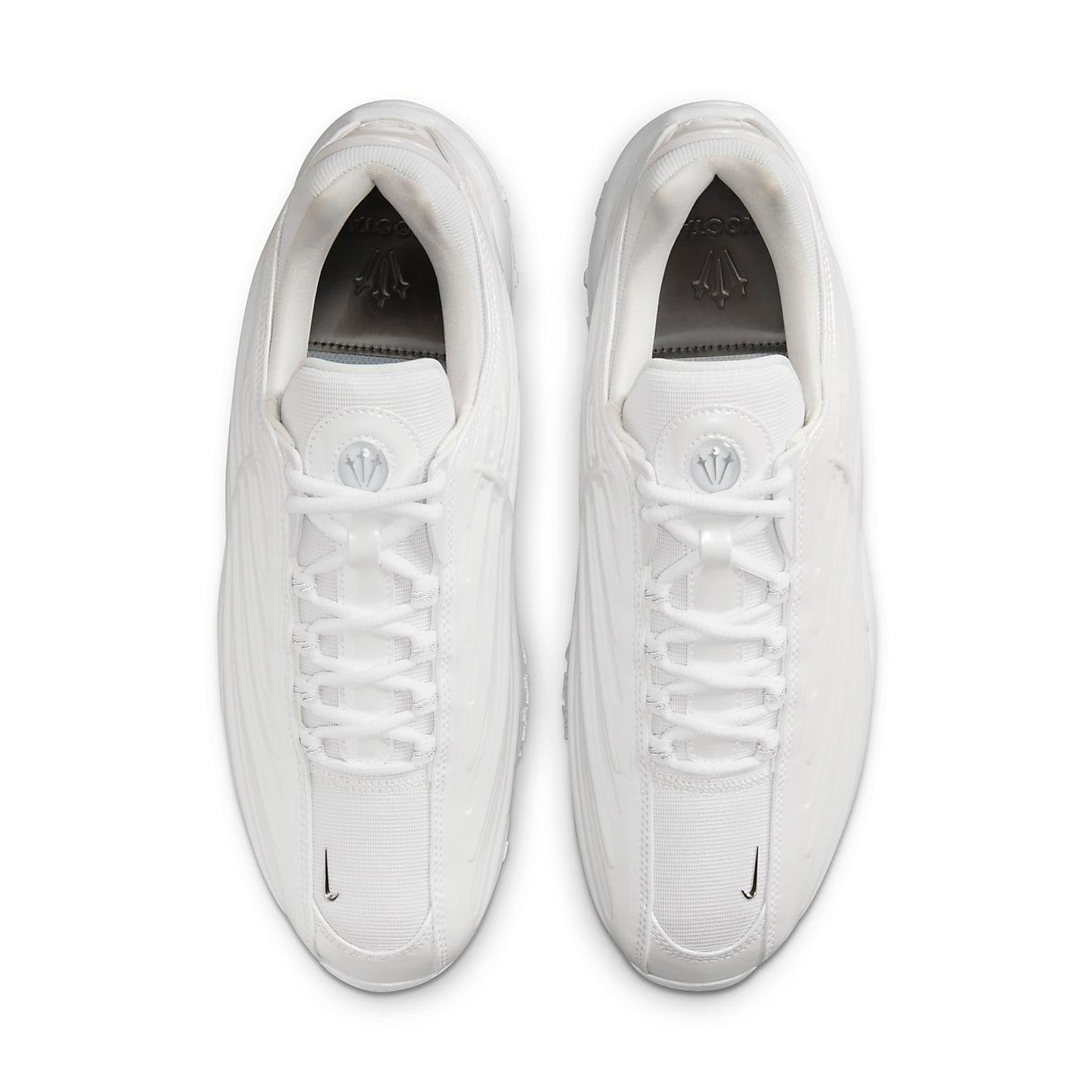 Top view of Nike Hot Step 2 Drake NOCTA sneakers in sleek white synthetic leather.