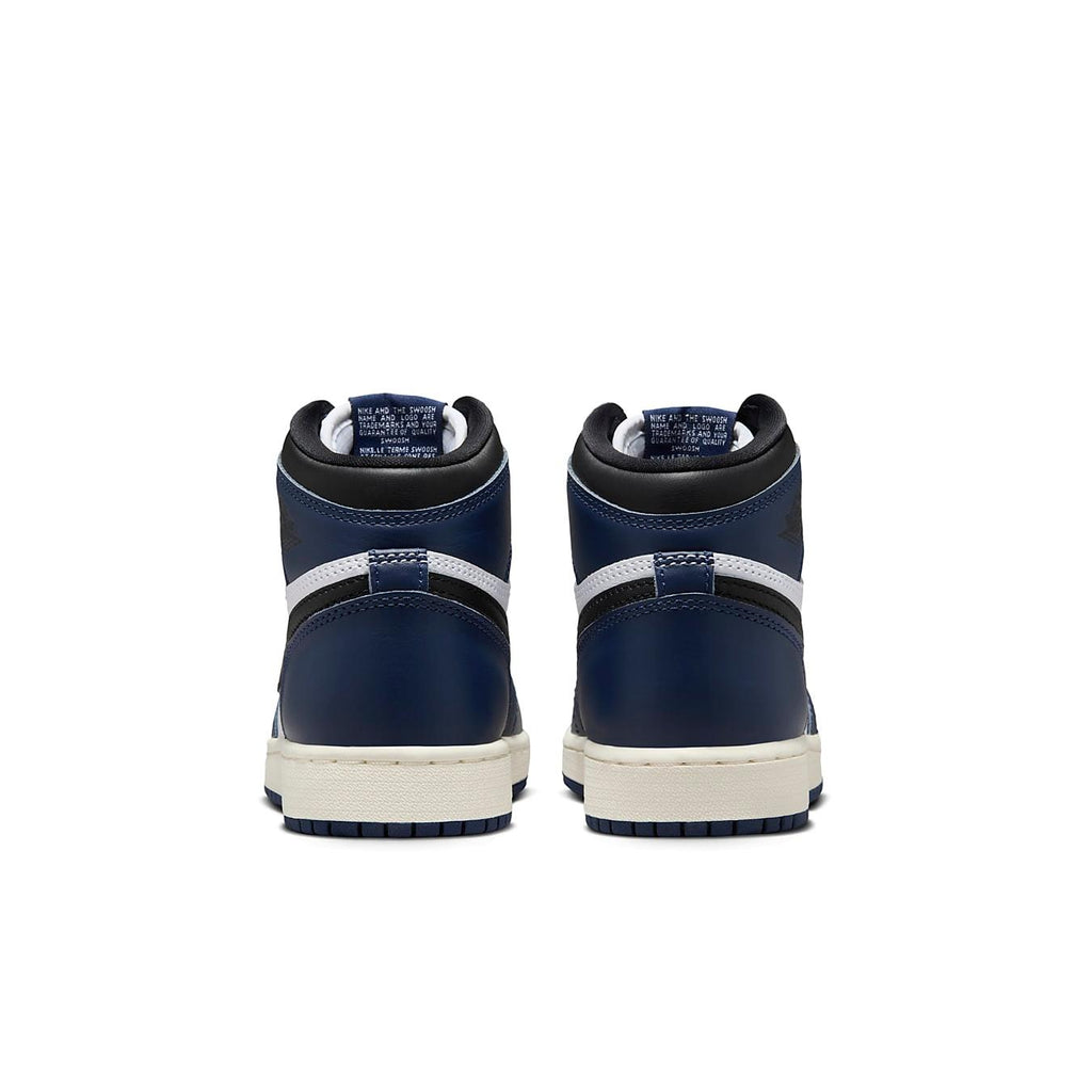 Back view of Jordan 1 Retro High OG Midnight Navy sneakers with navy upper and white detailing.