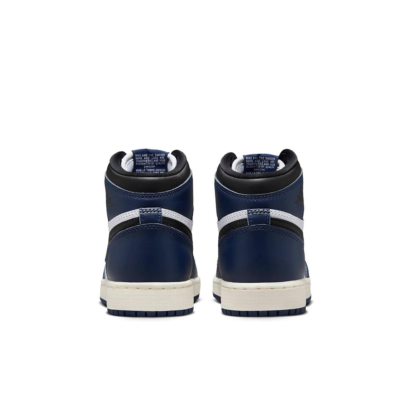 Back view of Jordan 1 Retro High OG Midnight Navy sneakers with navy upper and white detailing.