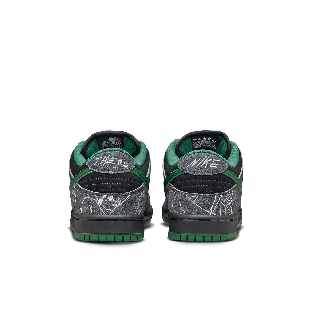 Back view of Nike SB Dunk Low THERE Skateboards featuring suede black and grey with green accents.