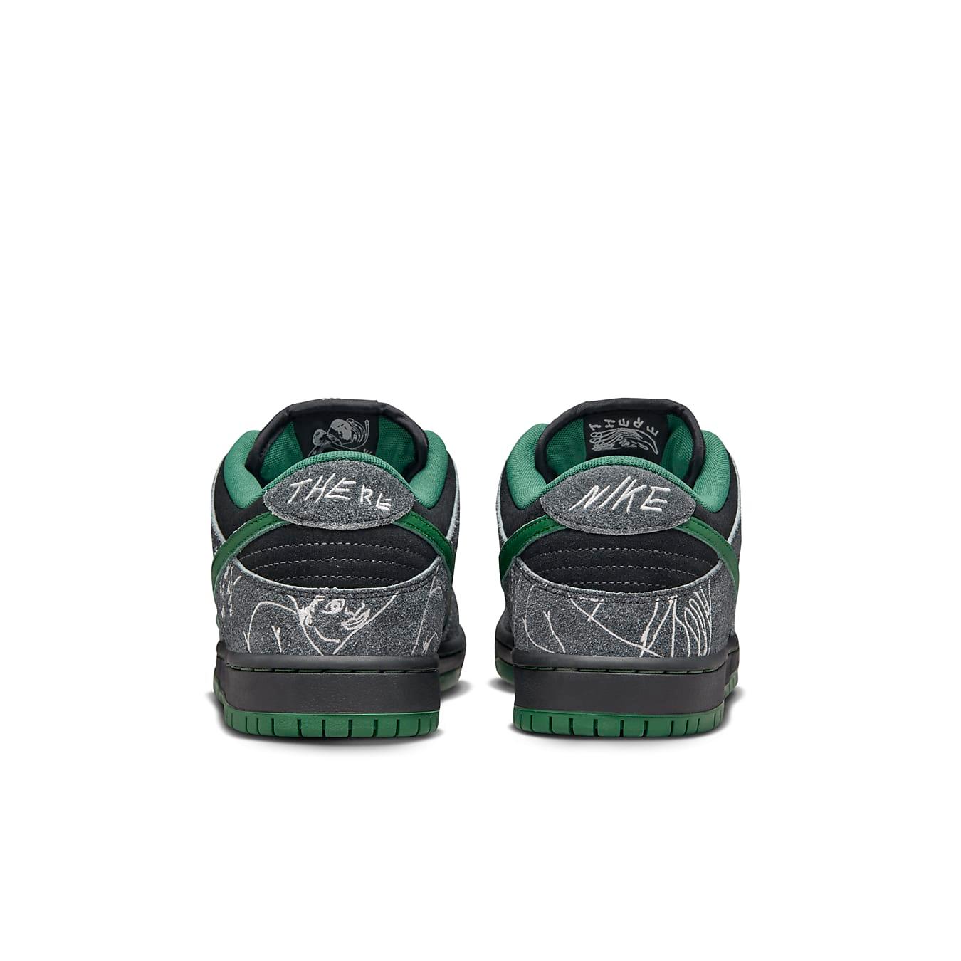 Back view of Nike SB Dunk Low THERE Skateboards featuring suede black and grey with green accents.