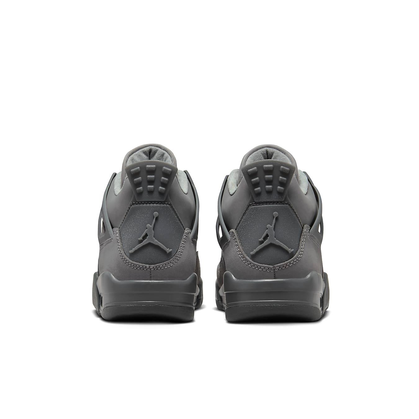Rear view of Jordan 4 Retro SE Paris Olympics Wet Cement sneakers showing dark gray color and unique heel design.