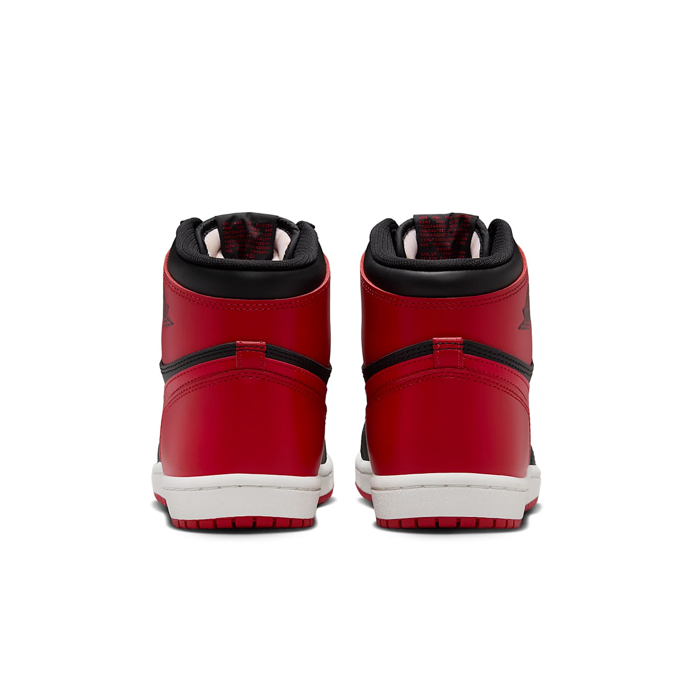 Jordan 1 Retro High '85 OG Bred 2025 sneakers showing the back view with black and red design.