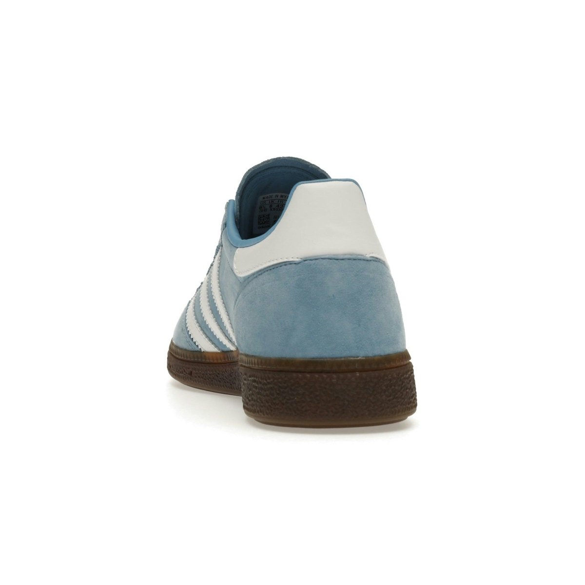 adidas Handball Spezial sneaker in light blue with white stripes, showcasing high-quality suede and vintage design.