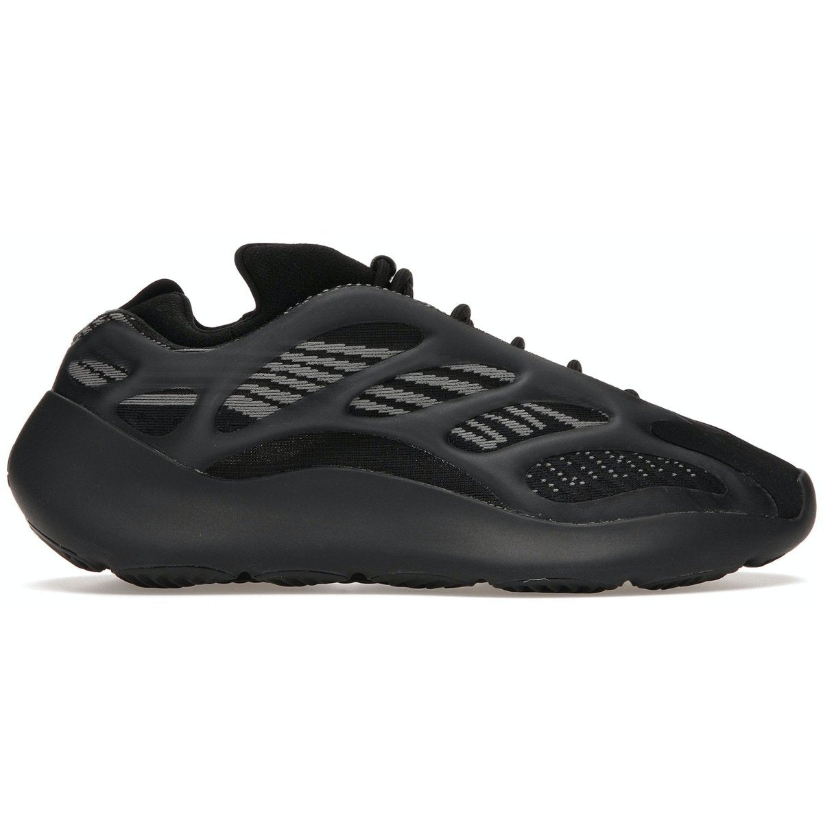 adidas Yeezy 700 V3 Dark Glow in black mesh with RPU overlays, featuring a glow-in-the-dark cage design.