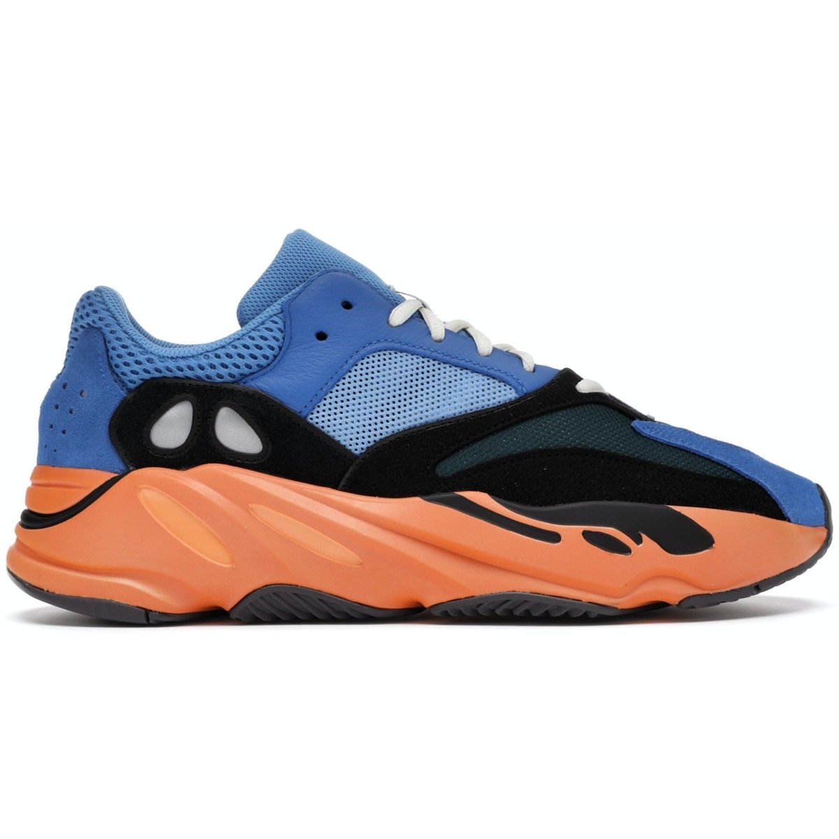 adidas Yeezy Boost 700 Bright Blue sneaker featuring vibrant blue leather and black suede overlays.