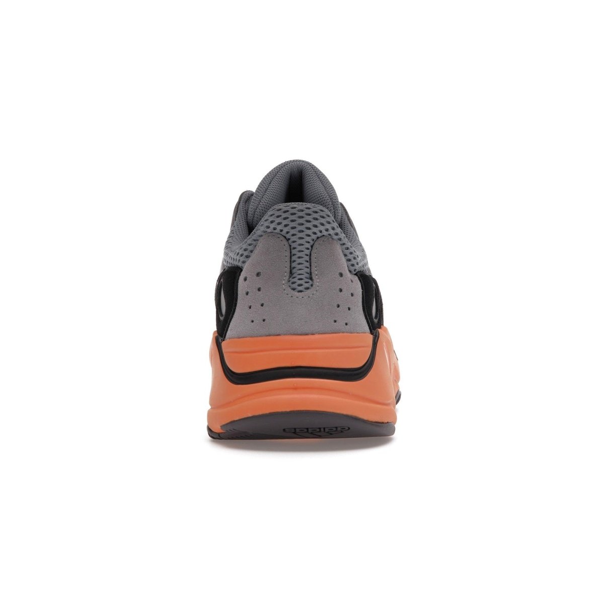 adidas Yeezy Boost 700 Wash Orange rear view showcasing sleek design and vibrant orange outsole.