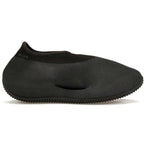 adidas Yeezy Knit RNR Fade Onyx shoe in black, showcasing its unique knitted design and slip-on style.