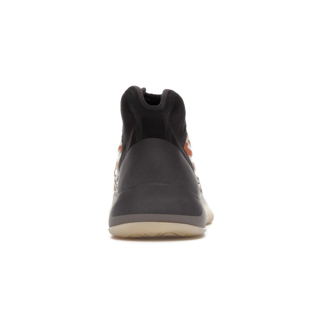 Adidas Yeezy QNTM Flash Orange sneaker rear view with flexible neoprene collar and contrasting colors.