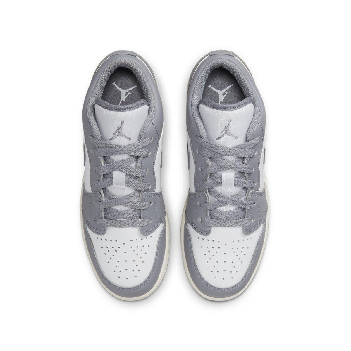 Top view of Air Jordan 1 Low Vintage Grey GS sneakers with white leather and grey overlays.