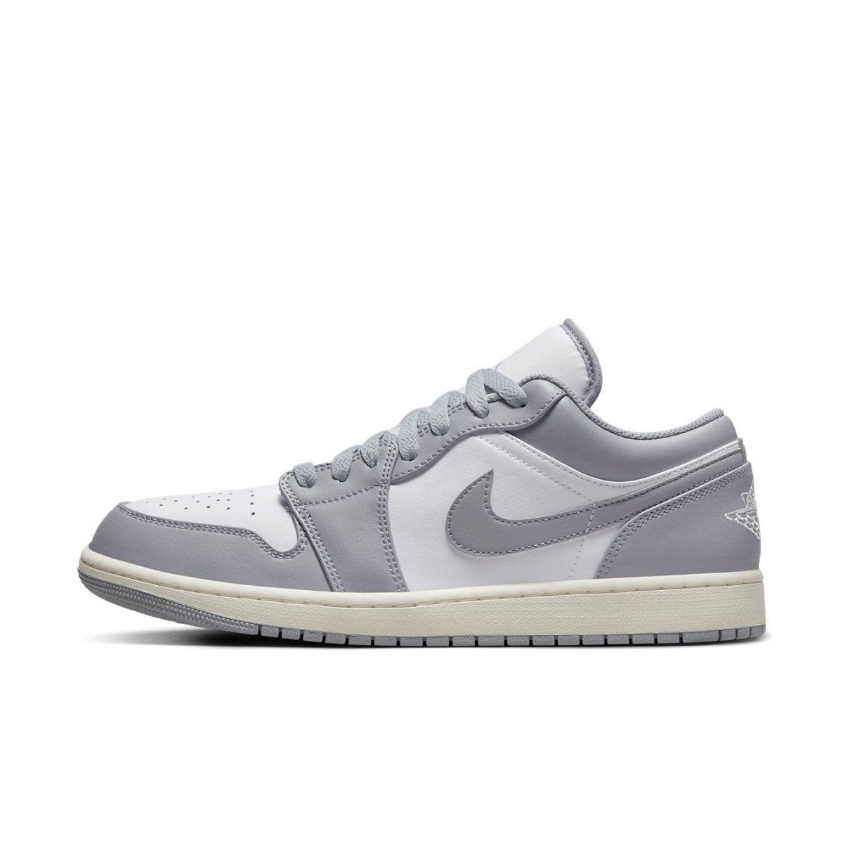 Air Jordan 1 Low Vintage Stealth Grey sneaker featuring white leather with grey overlays and vintage-style rubber sole.