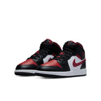 Air Jordan 1 Mid Black Fire Red sneakers showcasing black, red, and white design with iconic Swoosh.