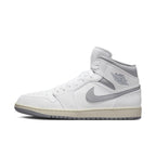 Air Jordan 1 Mid Neutral Grey featuring white leather and light grey accents, showcasing a stylish high-top design.