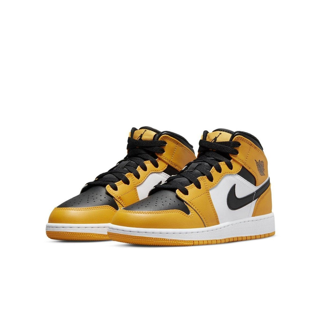 Air Jordan 1 Mid Taxi GS sneakers featuring black, white, and yellow leather design, perfect for stylish streetwear.