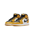 Air Jordan 1 Mid Taxi GS sneakers featuring black, white, and yellow leather design, perfect for stylish streetwear.