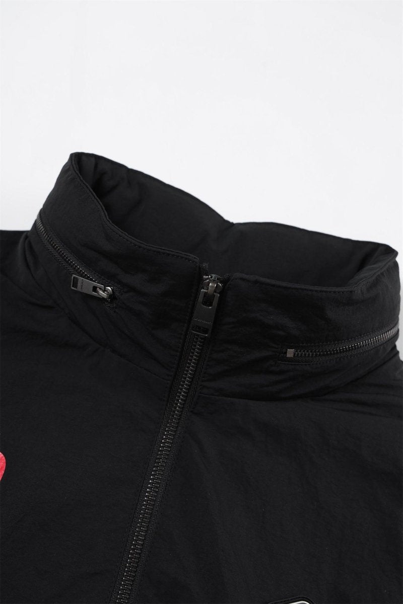 Close-up of the collar and zipper of the Black/Red NPT Baby Gang Zip Track Top jacket.