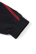 Detail of Black and Red NPT Baby Gang Zip Track Top showing elastic cuff and zip features.