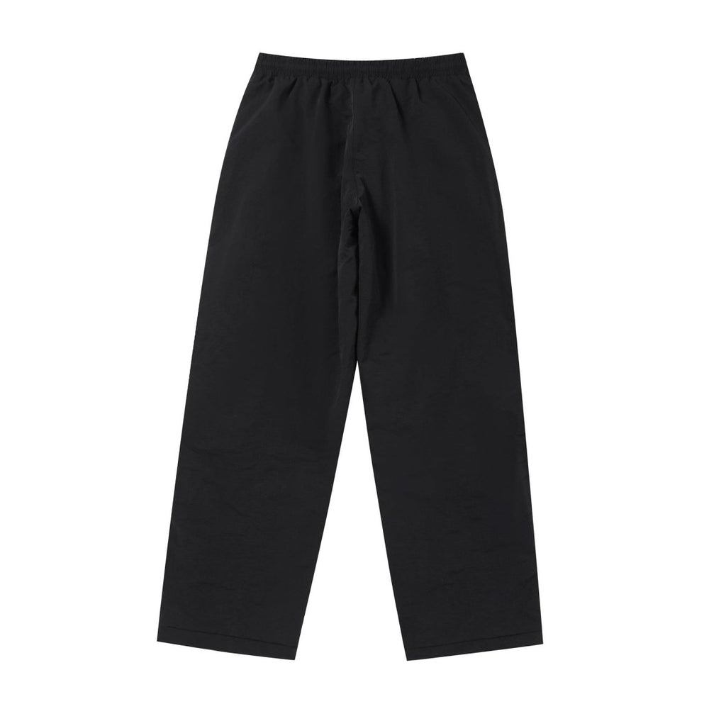 Black NPT Baby Gang zip track pants with a relaxed fit, featuring an elastic waistband for comfort.
