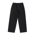 Black NPT Baby Gang zip track pants with a relaxed fit, featuring an elastic waistband for comfort.