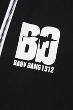 Detail of Black/White Baby Gang zip track pants featuring bold logo and design.