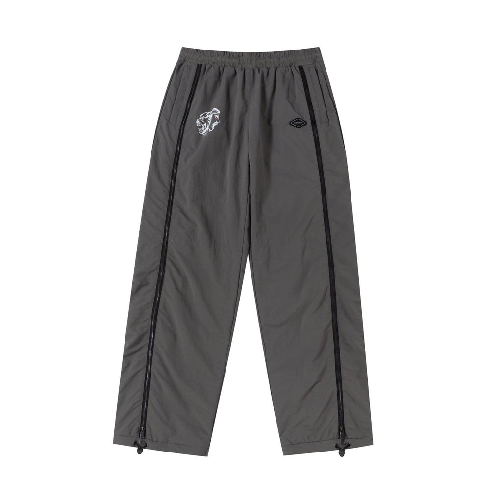 Grey and black NPT Simba La Rue zip track pants featuring a stylish design and elastic waistband for comfort.