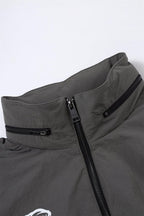 Close-up of the Grey/Black NPT Simba La Rue Zip Track Top showcasing the zipper and collar design.
