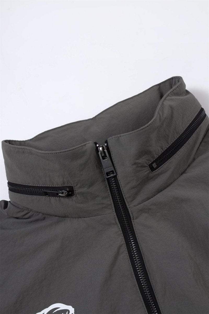 Close-up of the Grey/Black NPT Simba La Rue Zip Track Top showcasing the zipper and collar design.