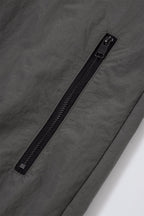 Close-up of the zip detail on the Grey/Black NPT Simba La Rue Zip Track Top, showcasing a sleek black zipper.